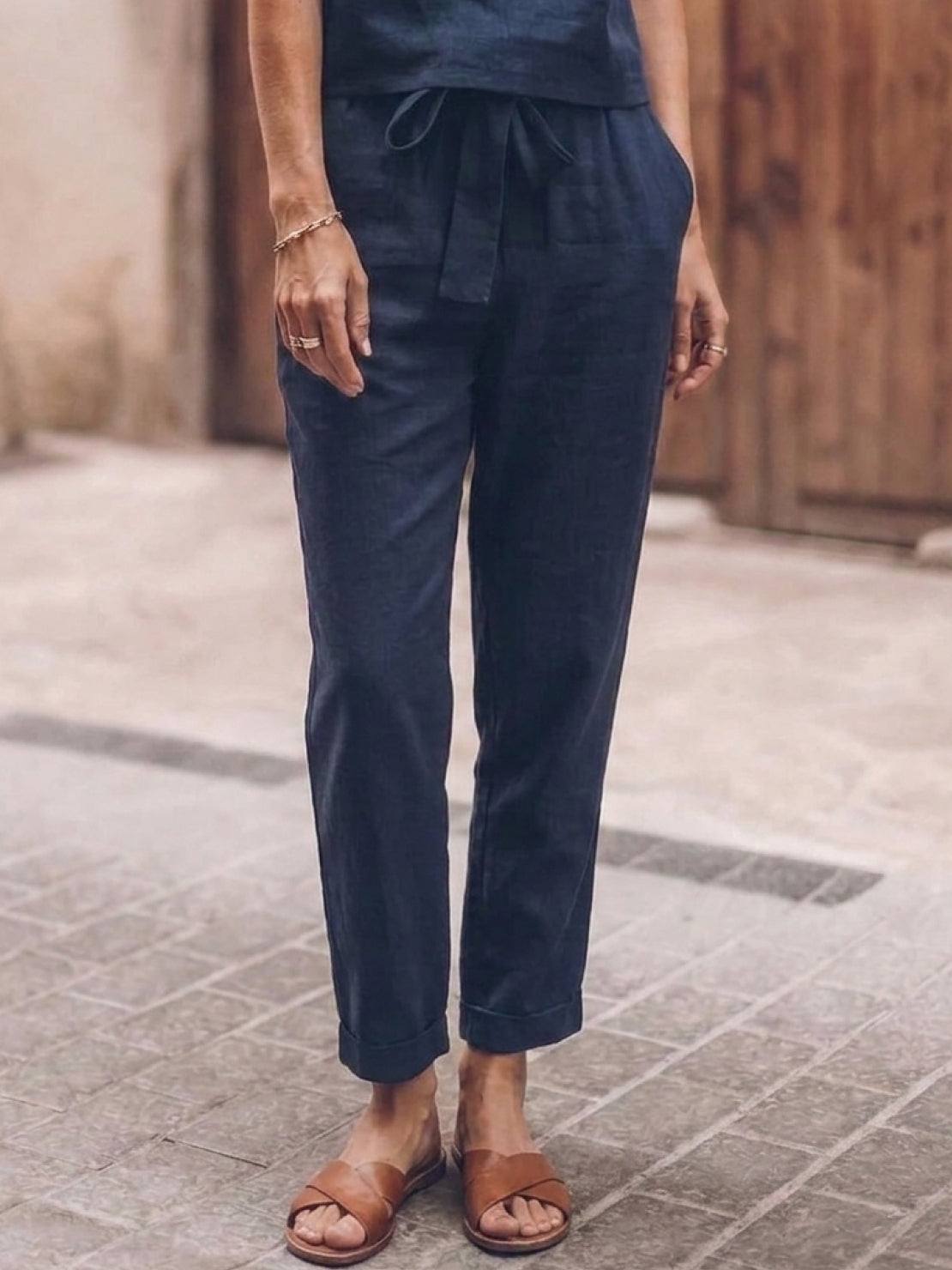woman wearing relaxed cotton-linen set with short-sleeve top and straight-leg pants in monochrome tone