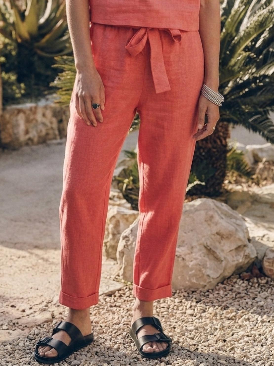 Woman wearing relaxed cotton-linen set with short-sleeve top and straight-leg pants in neutral tones