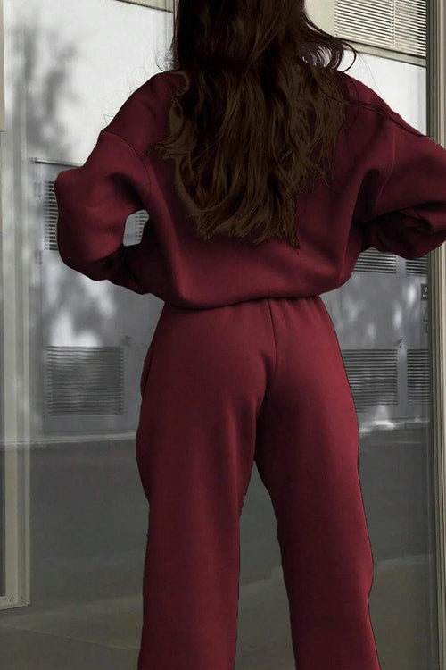 woman wearing burgundy Classic Airplane Set tracksuit from the back, casual athleisure outfit