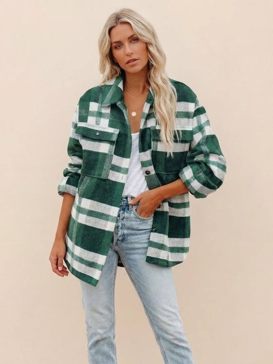 Woman wearing green and white comfy flannel classic button-down shirt with light blue jeans