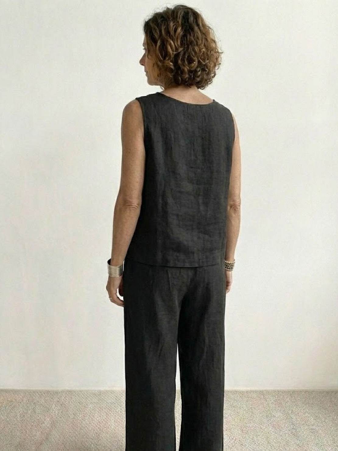 loose solid color sleeveless two-piece set in neutral tones with oversized fit and wide-leg pants