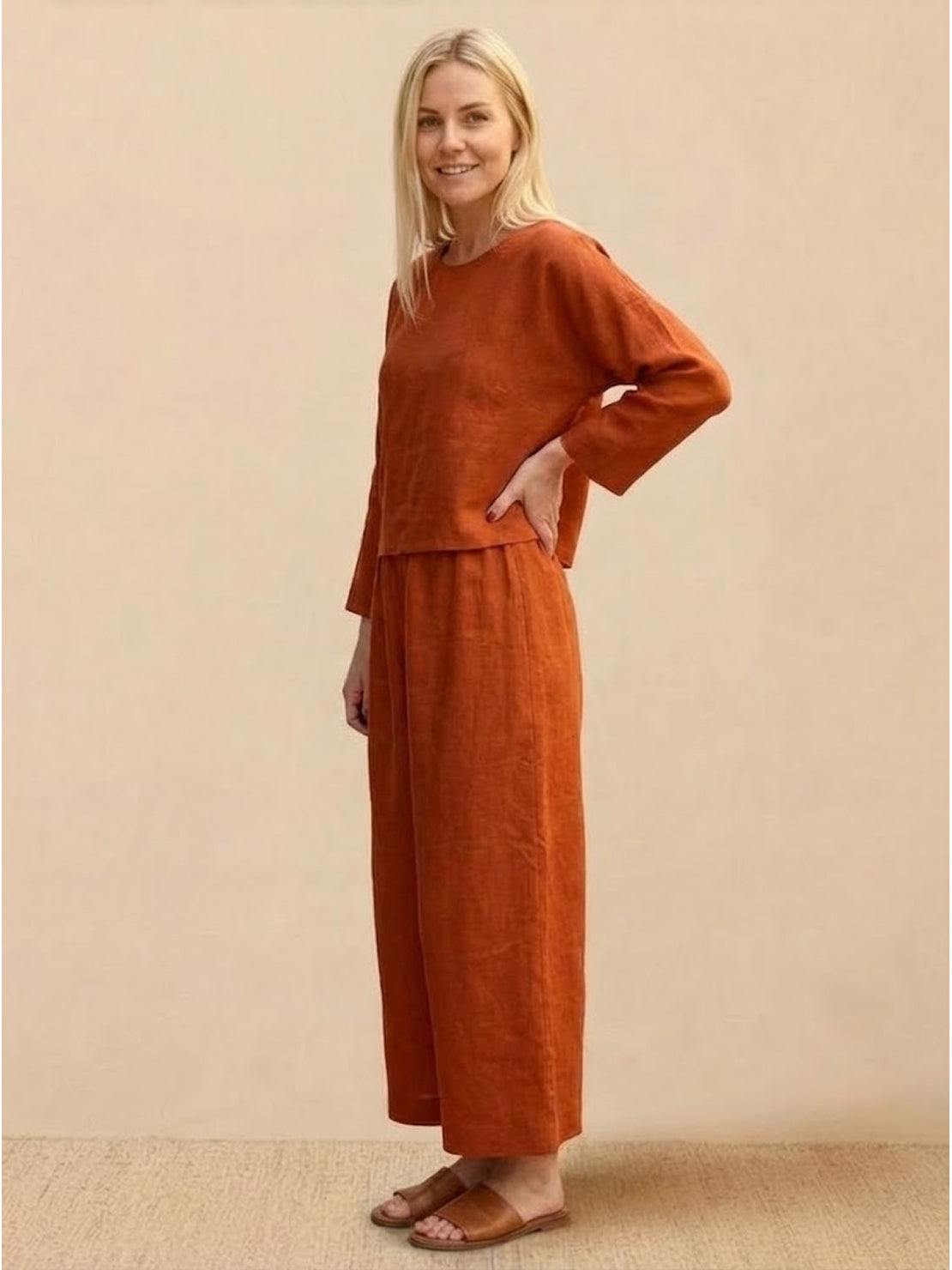 loose solid color two-piece set with round-neck top and wide-leg pants in breathable cotton blend fabric