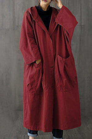 Oversized water resistant windbreaker jacket with hood and large pockets in red, one size fits all.