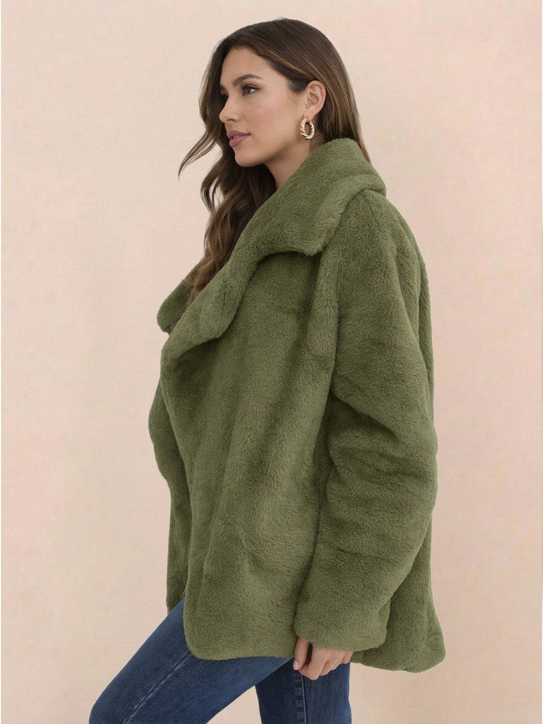 Green open front oversized faux fur jacket with draped shawl collar and mid-hip length worn by woman