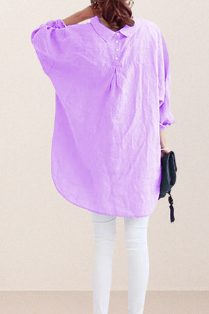 Back view of oversized linen shirt in light purple with relaxed fit and button detailing