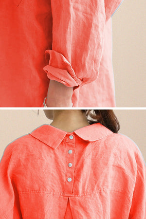Close-up of coral oversized linen shirt sleeve and back with button detailing and gathered fabric under the yoke