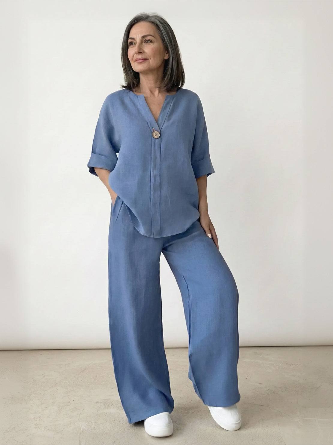 Woman wearing pure linen two-piece casual comfort set in light beige outdoors