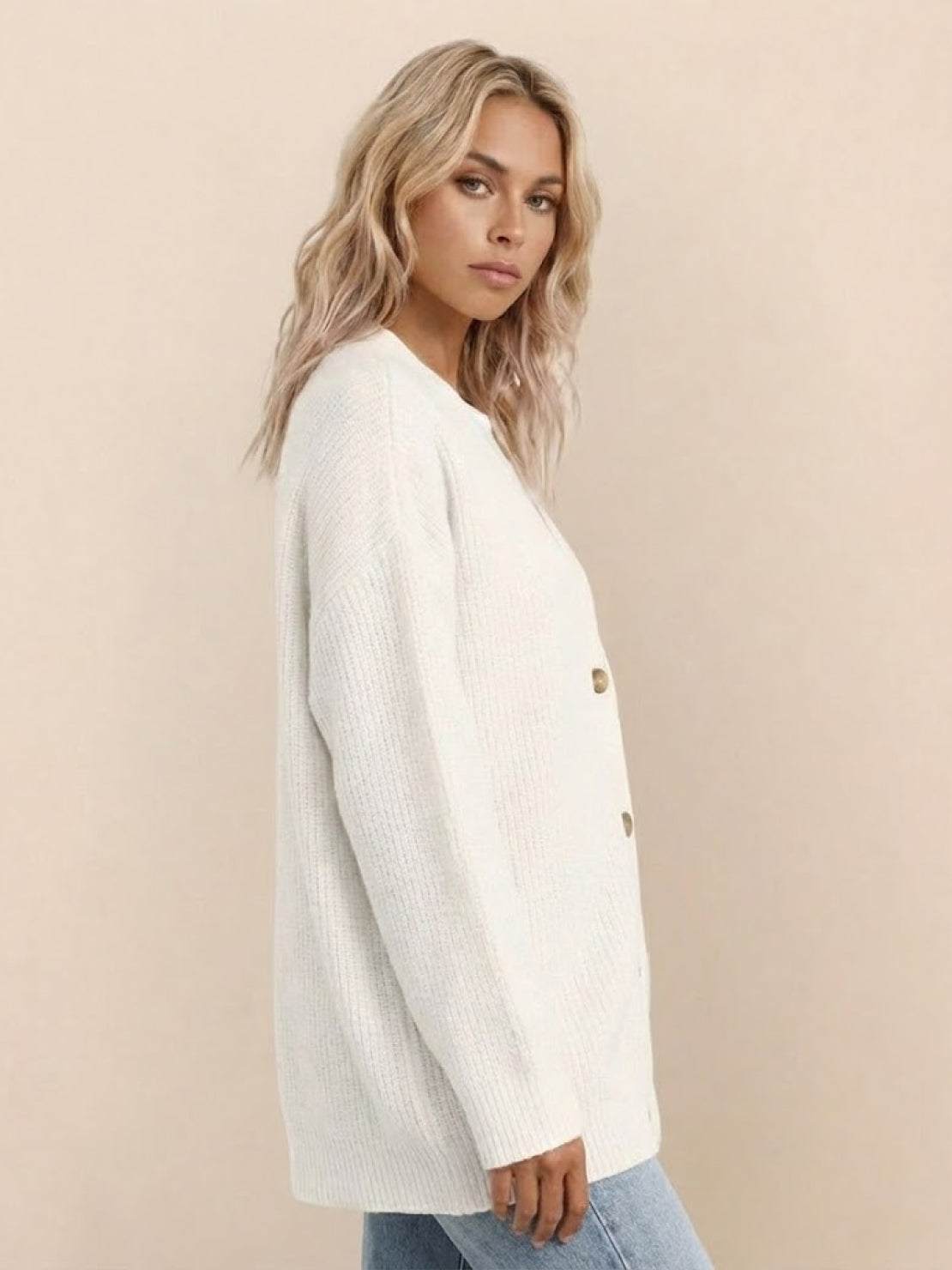 Relaxed fit oversized white knitwear cardigan with button down front on model