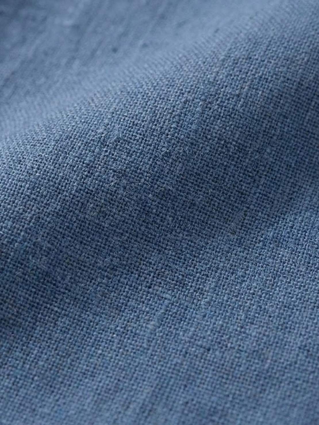 Close-up texture of blue lightweight cotton fabric for a breathable cotton dress