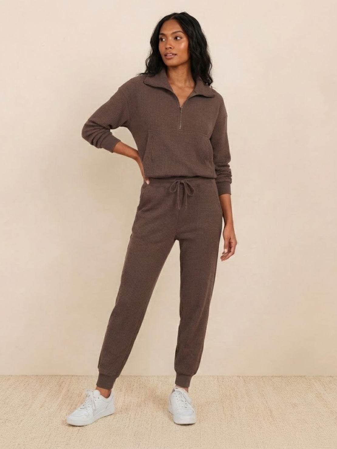 Unisex half-zip pullover and matching sweatpants set in soft fabric for casual comfort and relaxed fit