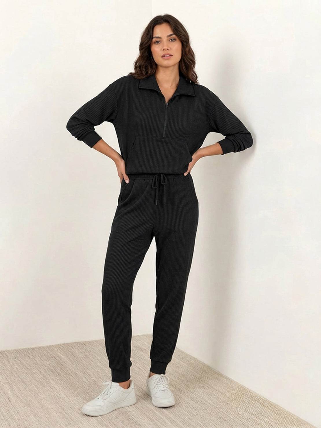 Unisex half-zip pullover and matching sweatpants set in soft fabric for casual comfort