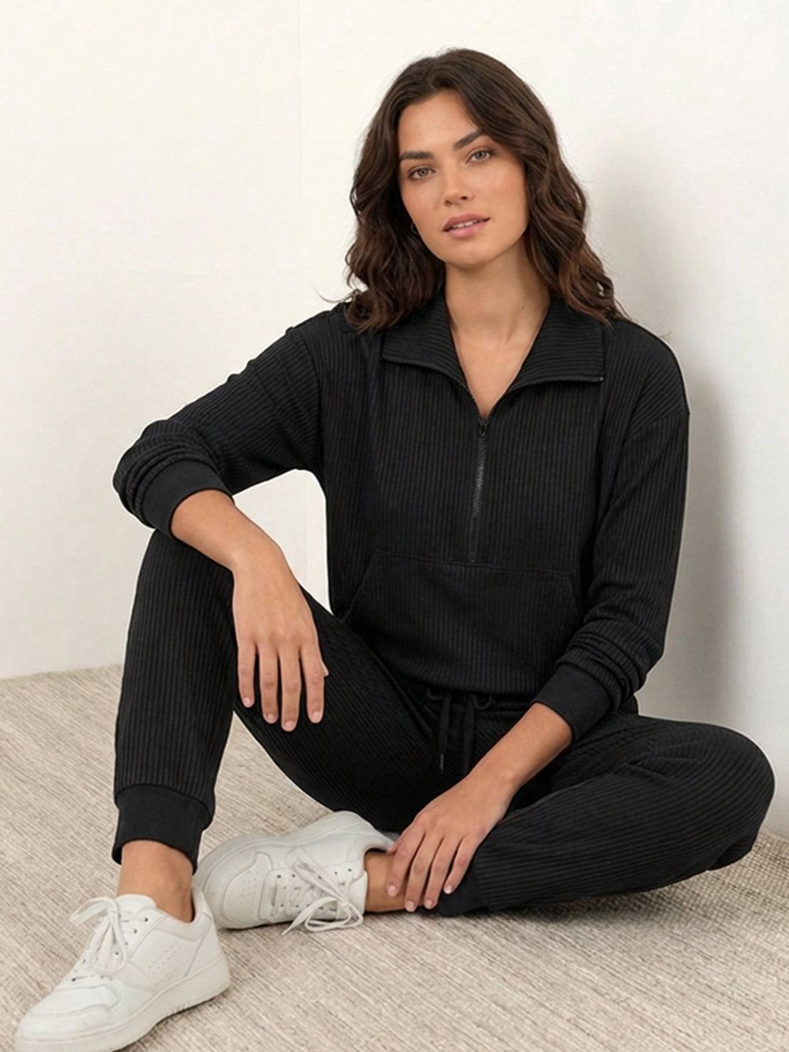 Unisex half-zip pullover and sweatpants set in relaxed fit with soft fabric for casual and travel wear