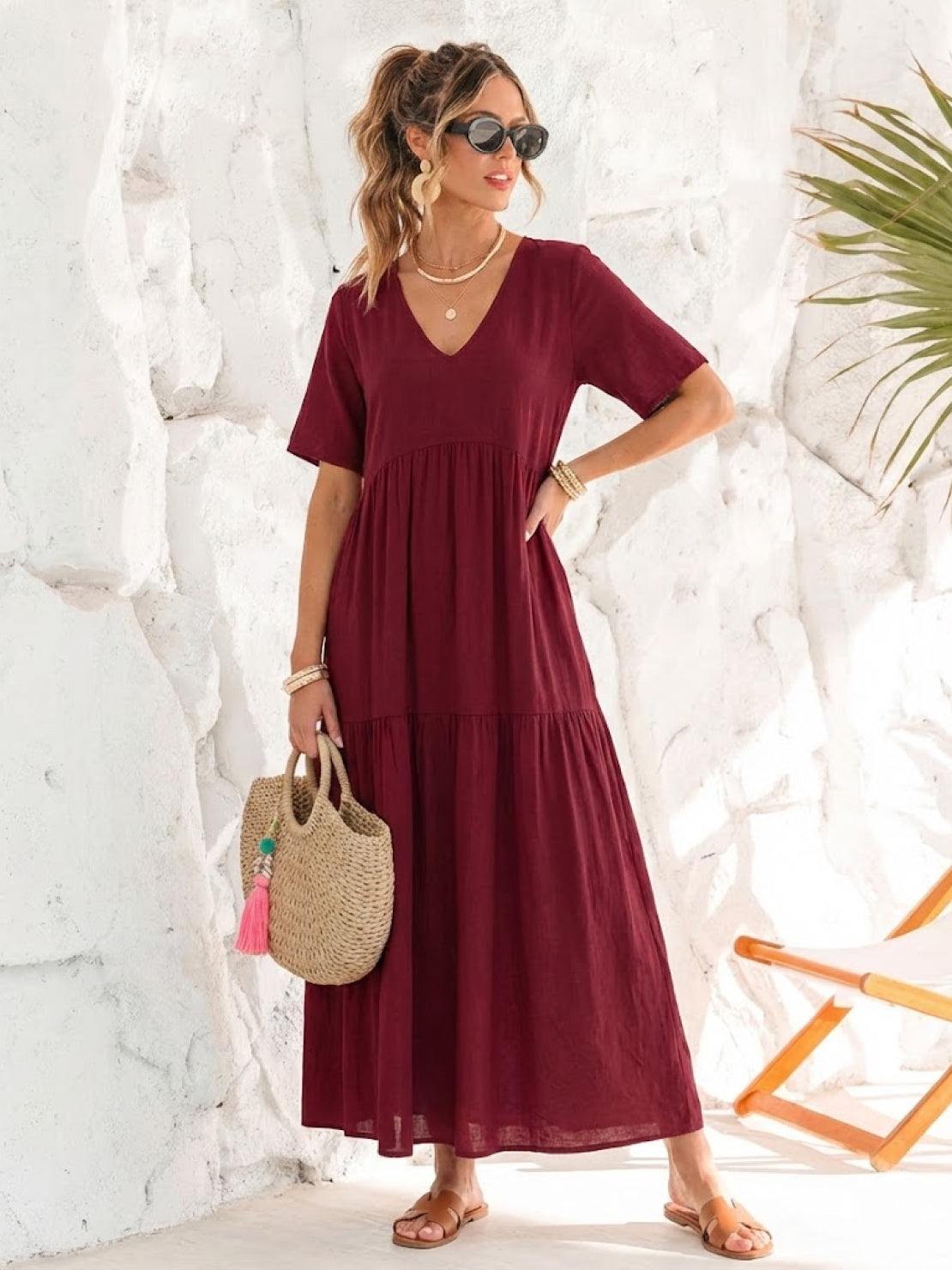V-neck two-tiered maxi swing dress in flowing cotton fabric with irregular hemline and draped sleeves