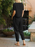 Breathable cotton linen monochrome straight-leg pants with adjustable drawstring waist and natural textured fabric