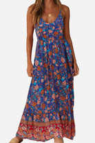 Woman wearing a blue vintage flower prints casual maxi dress with spaghetti straps and elastic waist