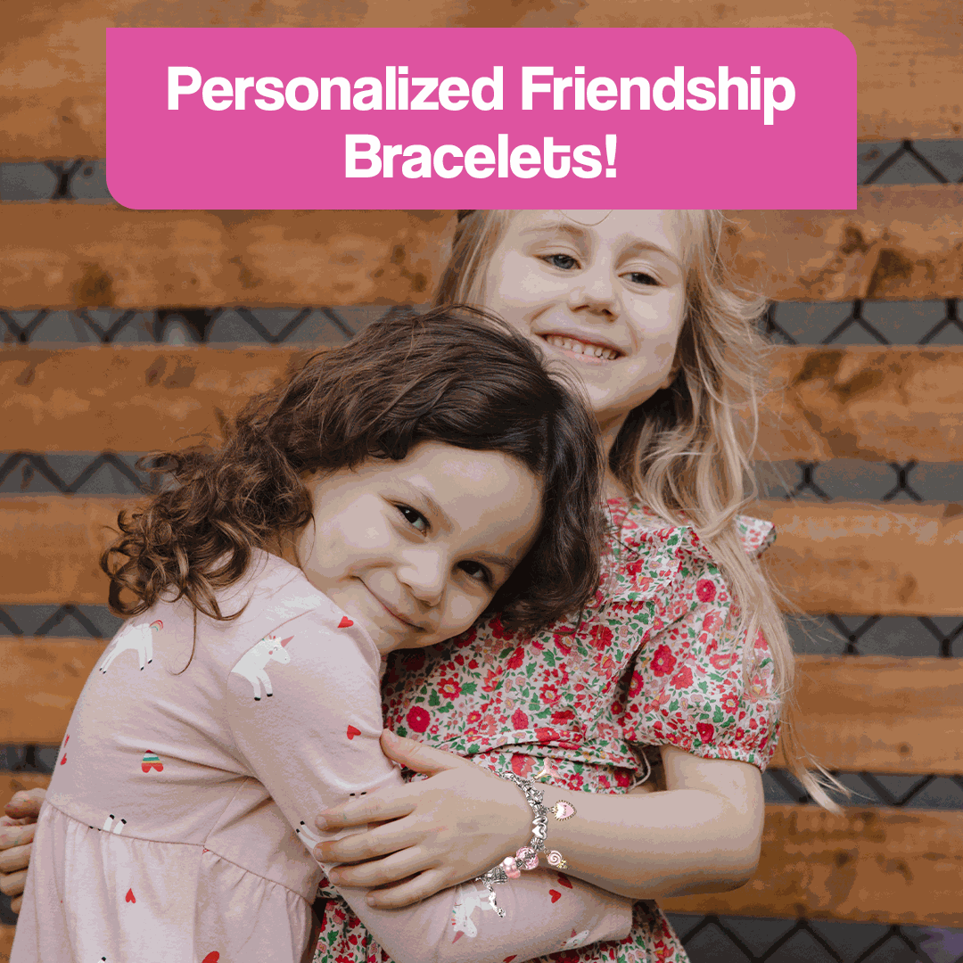 Two young girls smiling and hugging while wearing personalized friendship bracelets made using a kids bracelet-making kit