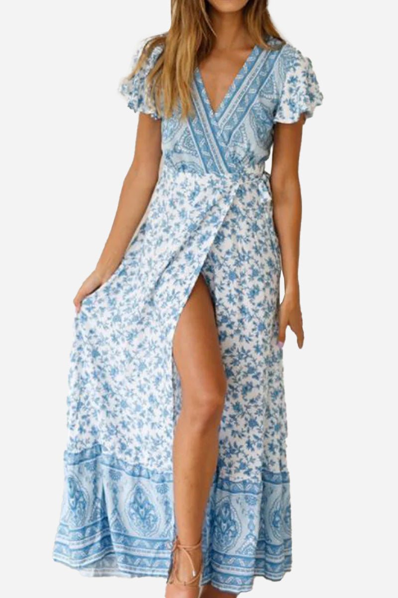 Bohemian floral print wrap dress with V-neck and high slit in blue and white cotton fabric