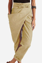Women wearing beige high-waist wrapped pants with a side pocket and belt detail