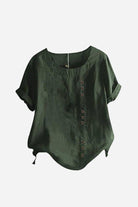 Dark green relaxed fit linen button-up tee with short sleeves and button detail