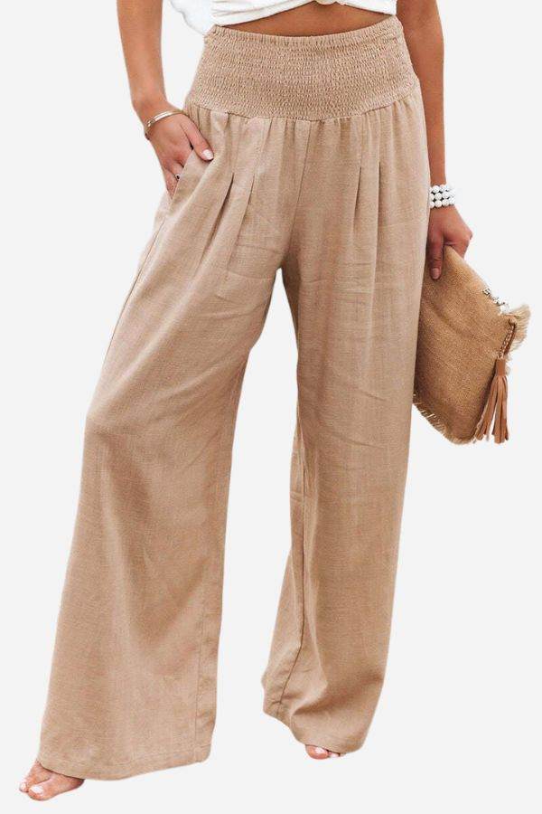 Beige high-waist palazzo pants with wide-leg fit and smocked waistband in lightweight cotton linen blend