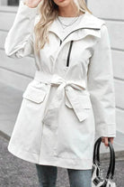 Women's white water-resistant windbreaker trench jacket with belt and front pockets