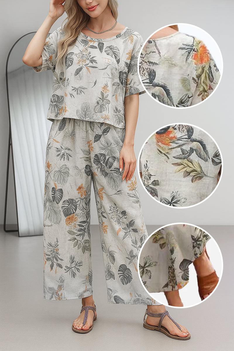 Woman wearing floral print loose fit co-ord set with wide-leg pants and short-sleeve top in light breathable fabric