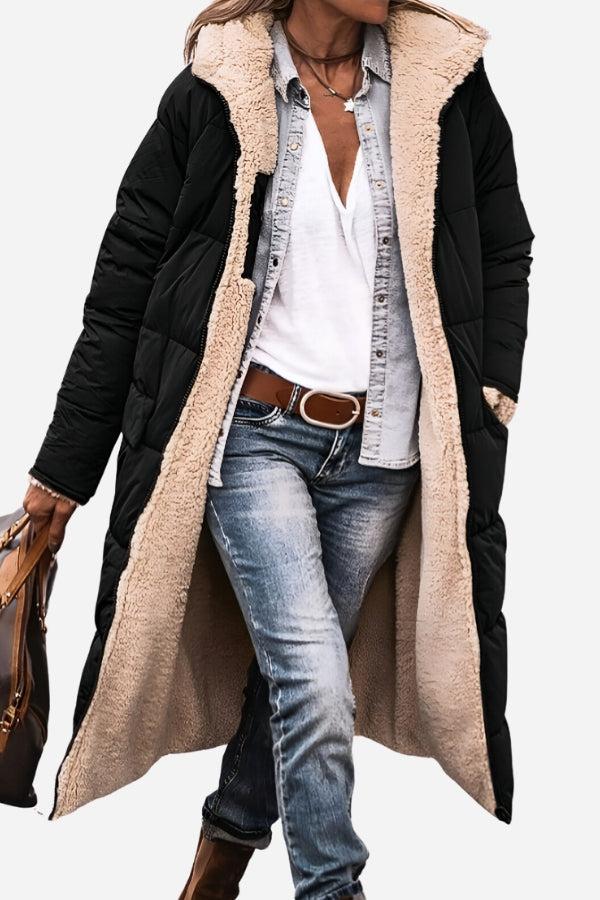 Black sherpa-lined hooded teddy coat with plush interior and long silhouette worn with casual jeans and white shirt
