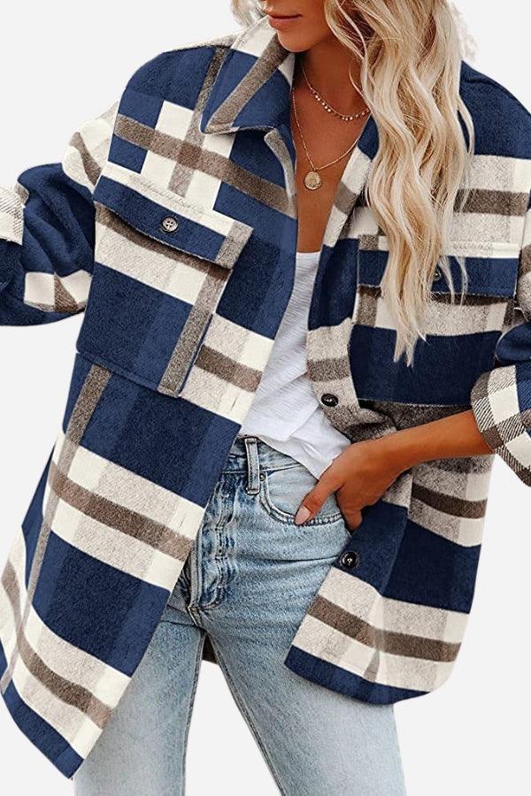 Woman wearing navy blue and white plaid comfy flannel classic button-down shirt with front pocket and light wash jeans