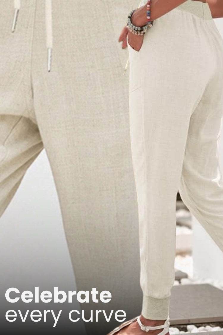 Beige relaxed chic elastic ankles pants with a comfortable fit and tapered cuffs.