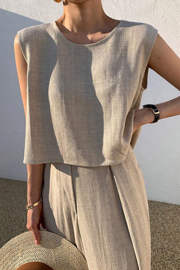 Woman wearing beige Casual Radiance Loose-Fit Combo sleeveless top and loose pants, styled for casual comfort and elegance.