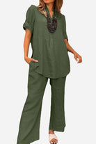 Olive green short-sleeved V-neck top and wide trouser suit in premium cotton with a loose, drapey fit for casual and semi-formal wear.
