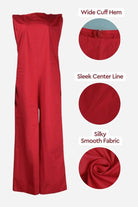 Red sleeveless wide-leg jumpsuit with silky smooth fabric, wide cuff hem, and sleek center line detail.