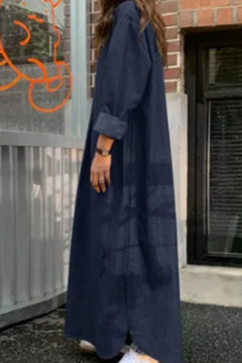 Woman wearing a navy blue body-balancing, temperature-controlled bohemian maxi dress with long sleeves, standing outdoors.