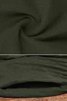 Close-up of dark green anti-shrink fabric texture and pocket detail of capped-sleeve voluminous pleated midi dress