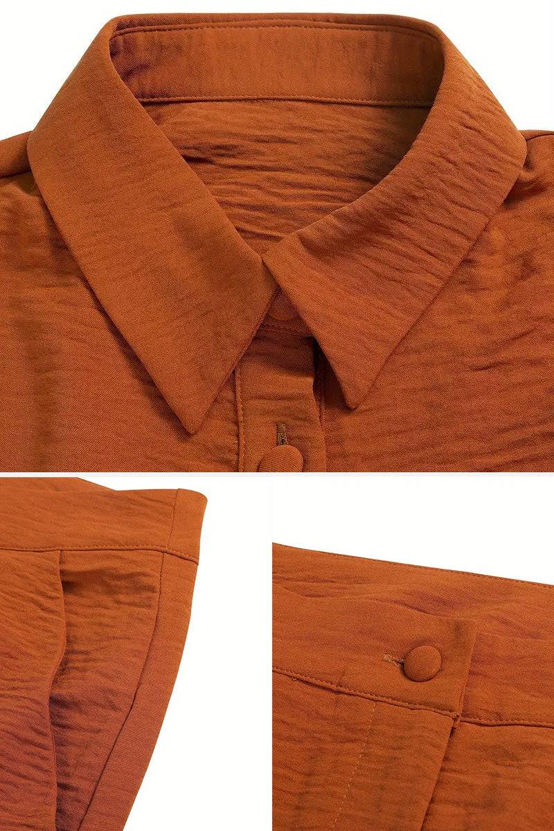 Close-up of rust-colored linen-look set with textured fabric, collar, buttons, and pocket details.