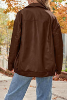 Brown oversized faux leather motorcycle jacket with relaxed fit and casual style