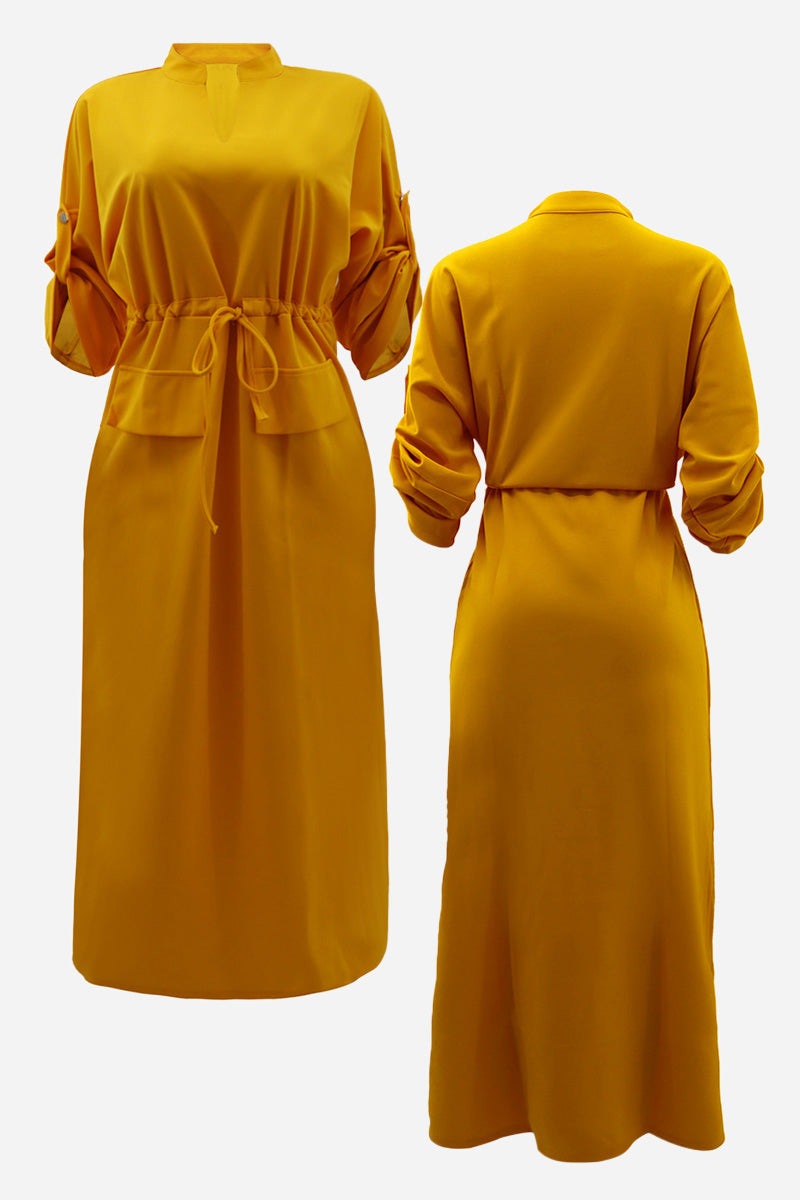 All-Day Drape Dress in mustard yellow with adjustable waist tie and roll-up sleeves, front slit, breathable wrinkle-resistant fabric.