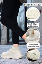 Fleece-lined comfort clogs with waterproof construction, sock-style ankle collar, and durable traction sole for all-weather wear