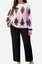 Plus Size Easy Elegance set with pink patterned long sleeve top and black loose pants.