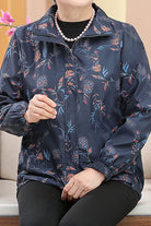 Plus Size WeatherShield floral jacket with water-resistant fabric and wind protection, featuring a lightweight, packable design in XL to 4XL sizes.