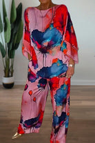 Plus size vibrant floral matching set with flowy silhouette in red, pink, and blue tones