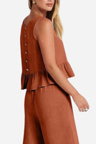 Women’s rust-colored sleeveless linen-like feel set with button-back top and matching pants