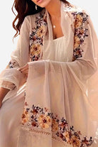 Lightweight beige embroidered travel-must shawl wrap with floral designs for versatile wear and sun protection
