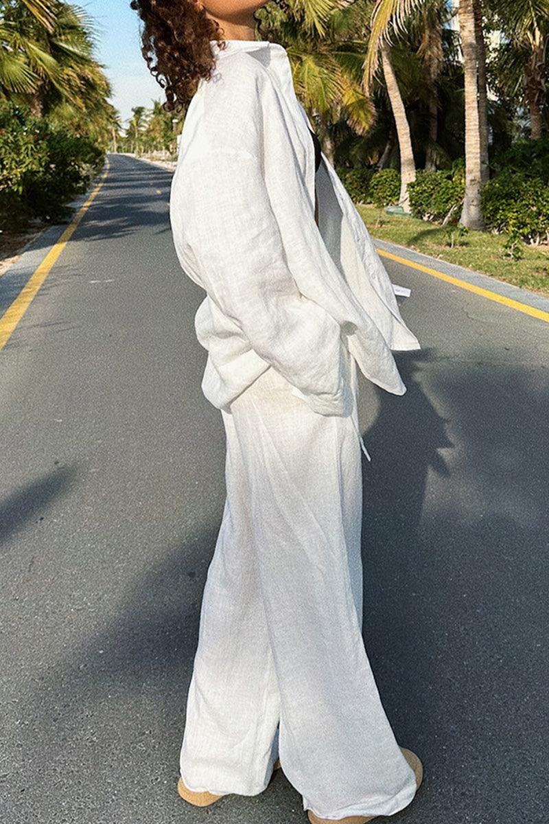 woman wearing white 100% cotton Wanderlust two-piece set walking outdoors