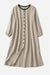 100% linen oversized button-down tunic dress in neutral beige with black contrast collar and buttons