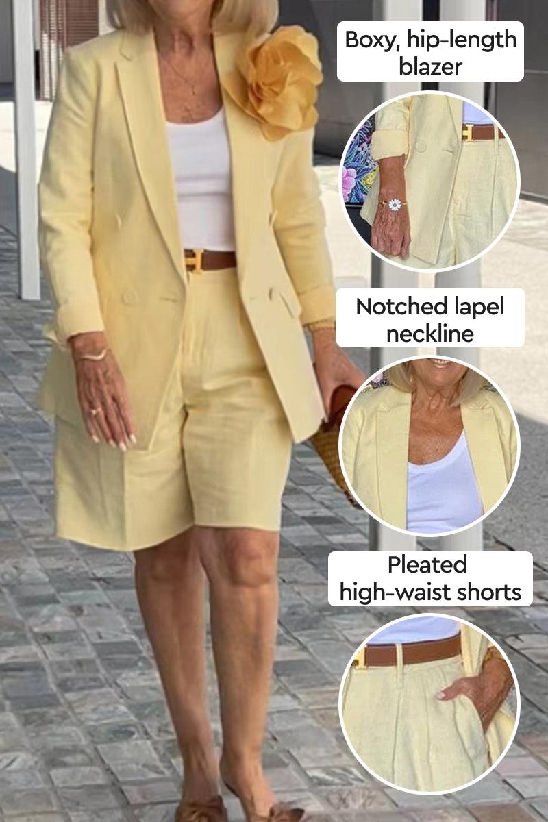 Woman wearing stylish blazer and shorts two-piece set in pale yellow with notched lapel and pleated high-waist shorts