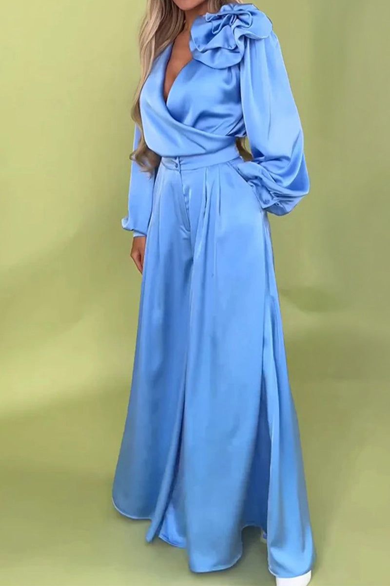 Elegant blue satin two-piece set with statement shoulder blouse and flowing palazzo pants