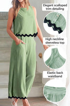 Green scalloped trim sleeveless top with high neckline and elastic back waistband paired with matching wide-leg pants