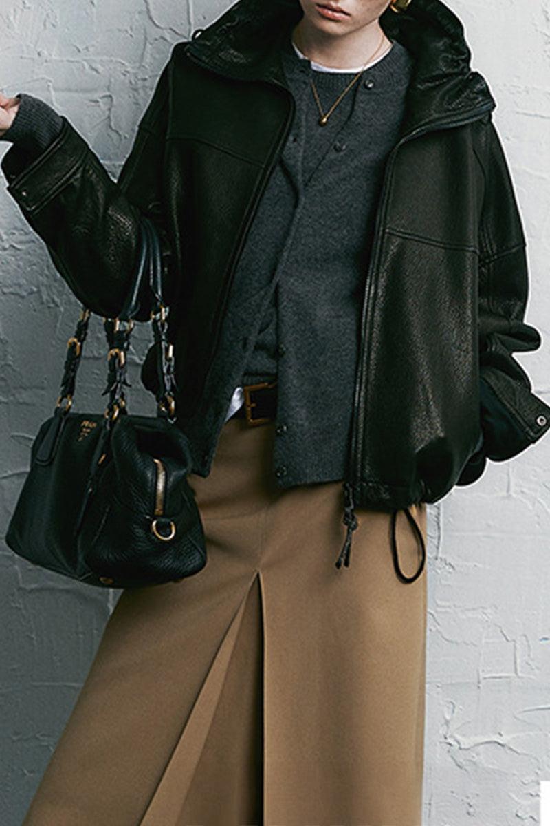 Black genuine sheepskin leather jacket with glossy finish styled with casual outfit and handbag