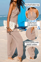 Woman wearing Sunshine On Sand ruched halter-neck jumpsuit with flowy pants and elastic ankle cuffs on beach